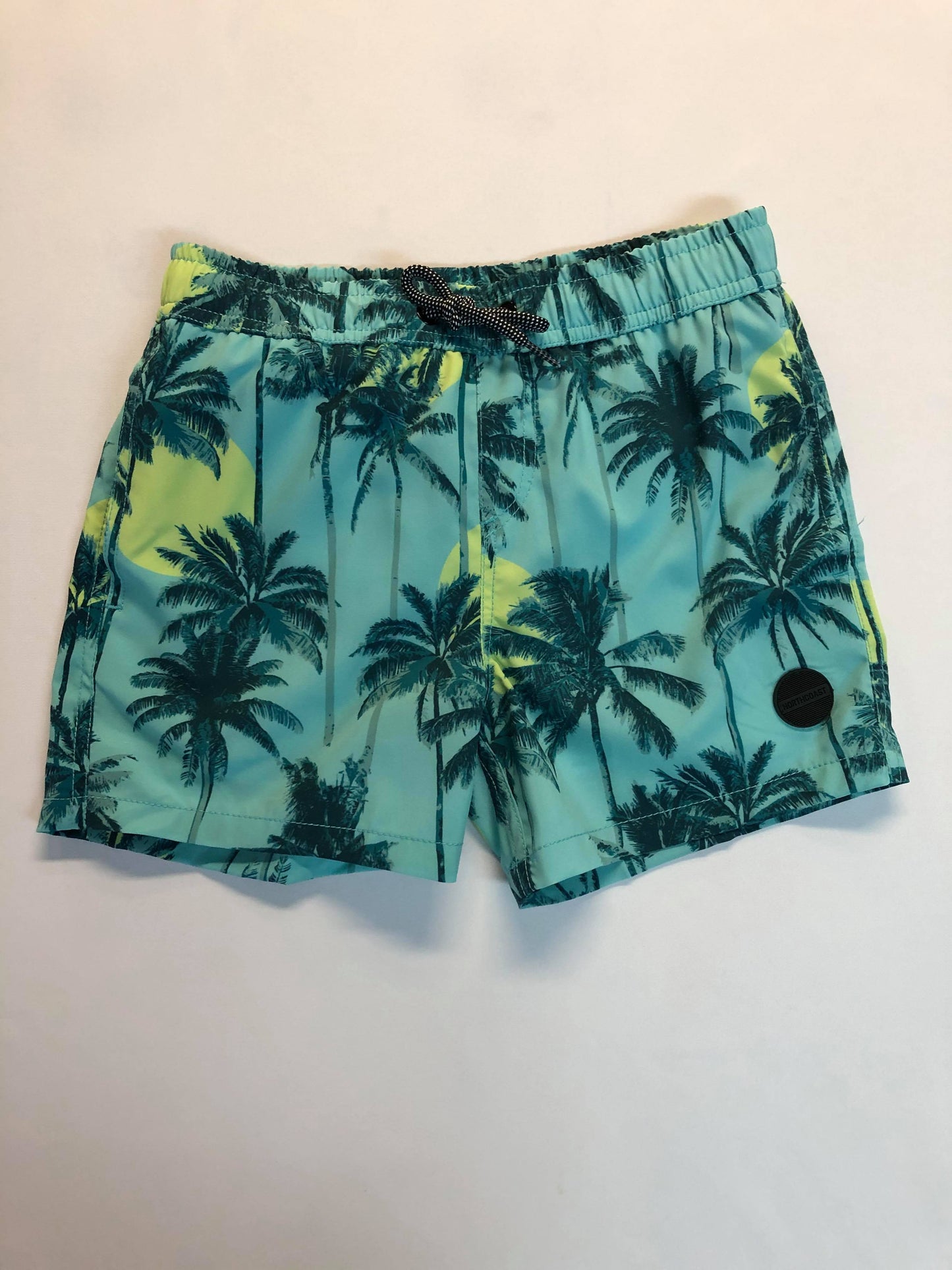 Short turquoise avec imprimé palmiers